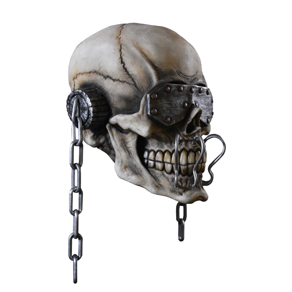 Human skull with metal eye patches and chains attached.